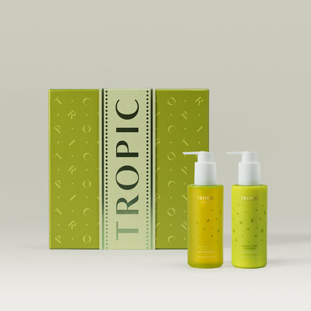 Tropic Skincare gift set titled Desert Lime & Ginger – winter hand collection, featuring two nourishing hand care products in fresh citrus green bottles, displayed alongside a matching green gift box.